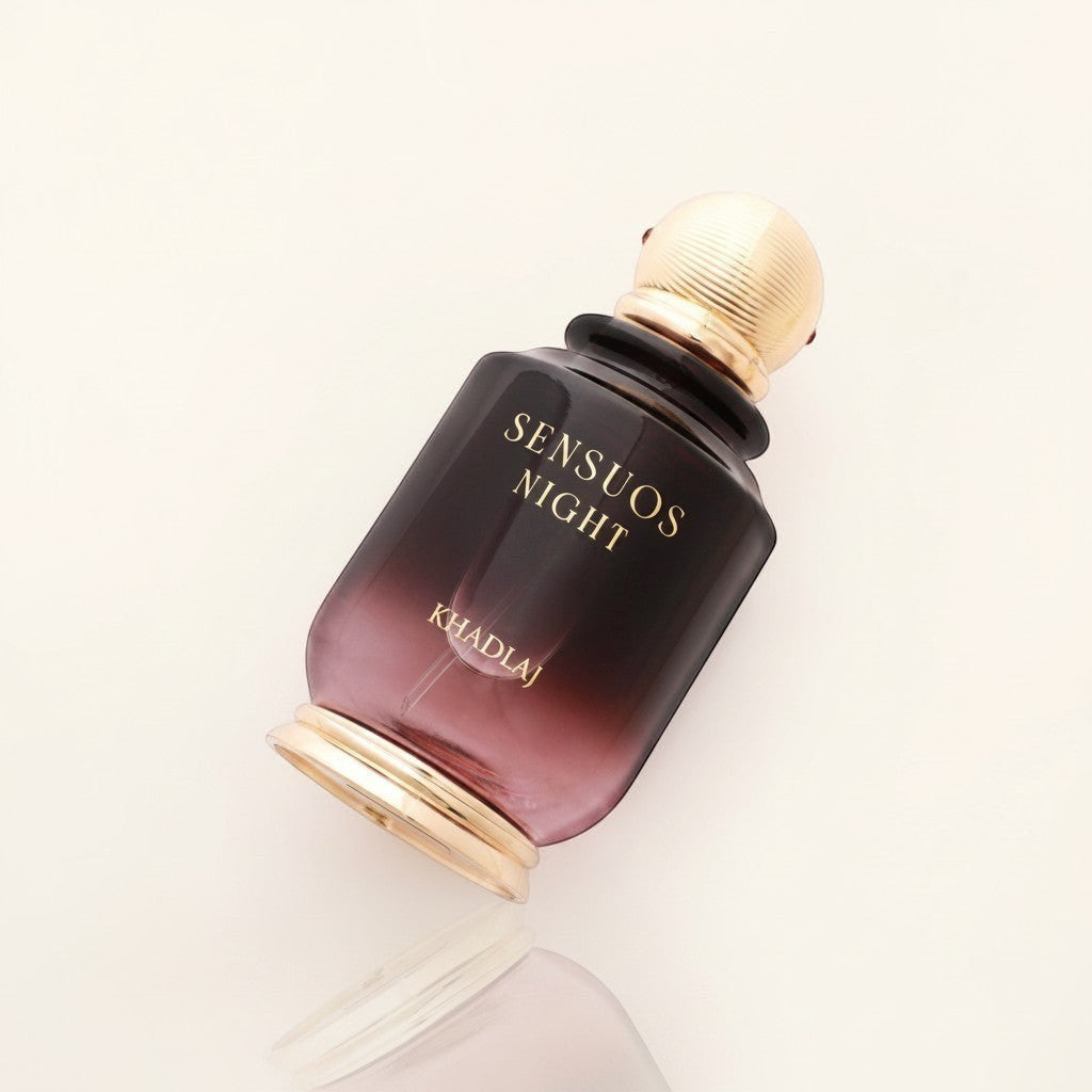 Oud Sera Khadlaj Sensuos Night perfume in a dark gradient glass bottle with a gold cap on a light background.