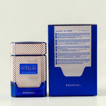 Oud Sera Khadlaj Shiyaaka Blue perfume bottle and matching blue box for men with metallic textured detailing