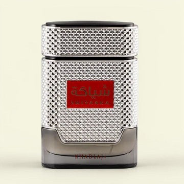 Oud Sera Khadlaj Shiyaaka Silver eau de parfum in a textured metallic silver bottle with a red label.