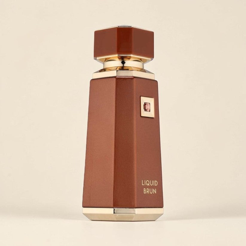Oud Sera French Avenue Liquid Brun unisex eau de parfum in a sleek brown bottle with gold accents.