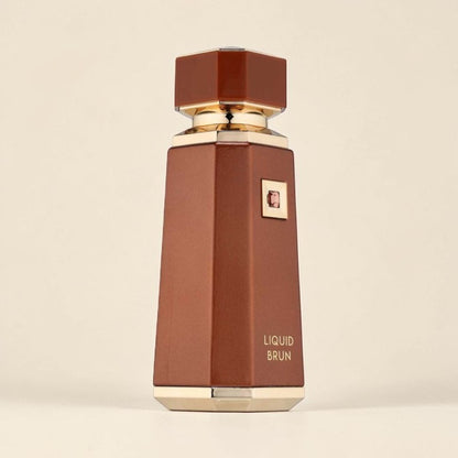 Oud Sera French Avenue Liquid Brun unisex eau de parfum in a sleek brown bottle with gold accents.