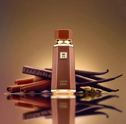 Oud Sera French Avenue Liquid Brun unisex perfume bottle surrounded by cinnamon sticks and vanilla beans.